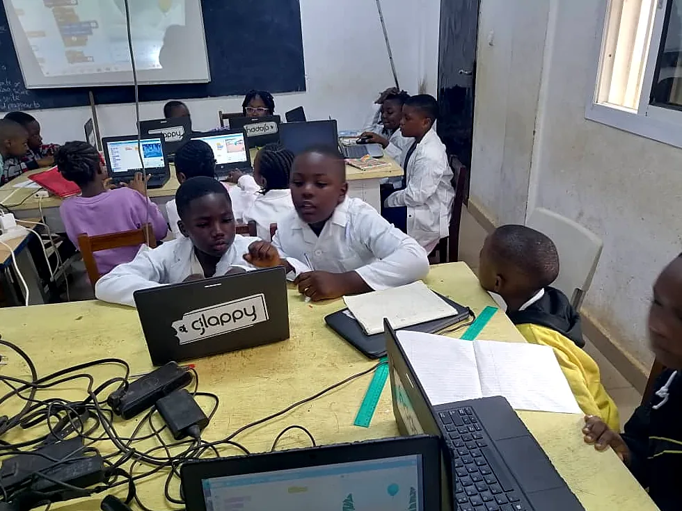 A classroom in Bamenda full of students working on Glappy laptops